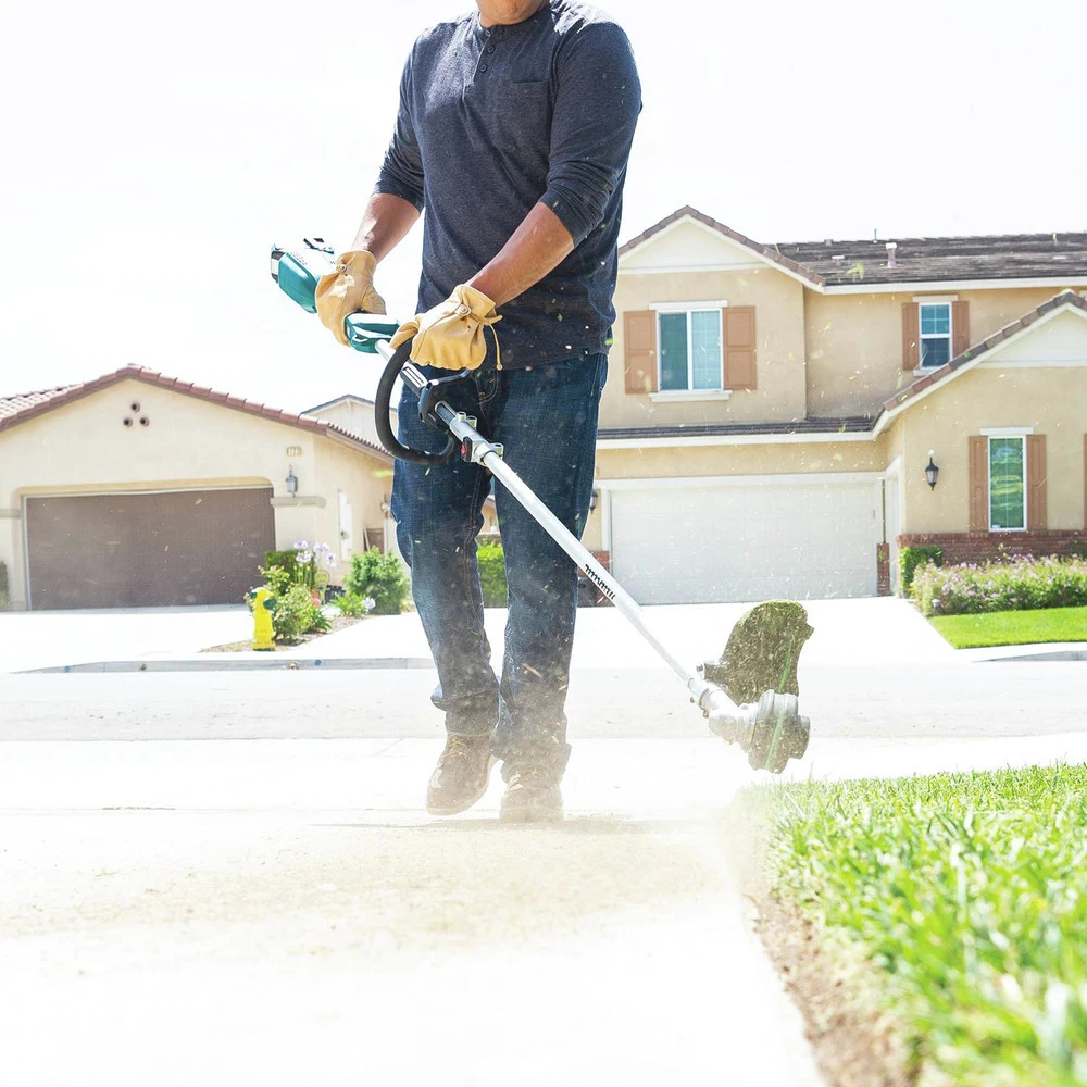 Makita XUX02SM1X3 18V LXT Brushless Lithium-Ion Cordless Couple Shaft Power Head Kit With 13 In. String Trimmer And Blower Attachments (4 Ah) 14 Makita XUX02SM1X3 18V LXT Brushless Lithium-Ion Cordless Couple Shaft Power Head Kit With 13 In. String Trimmer And Blower Attachments (4 Ah) - Image 12